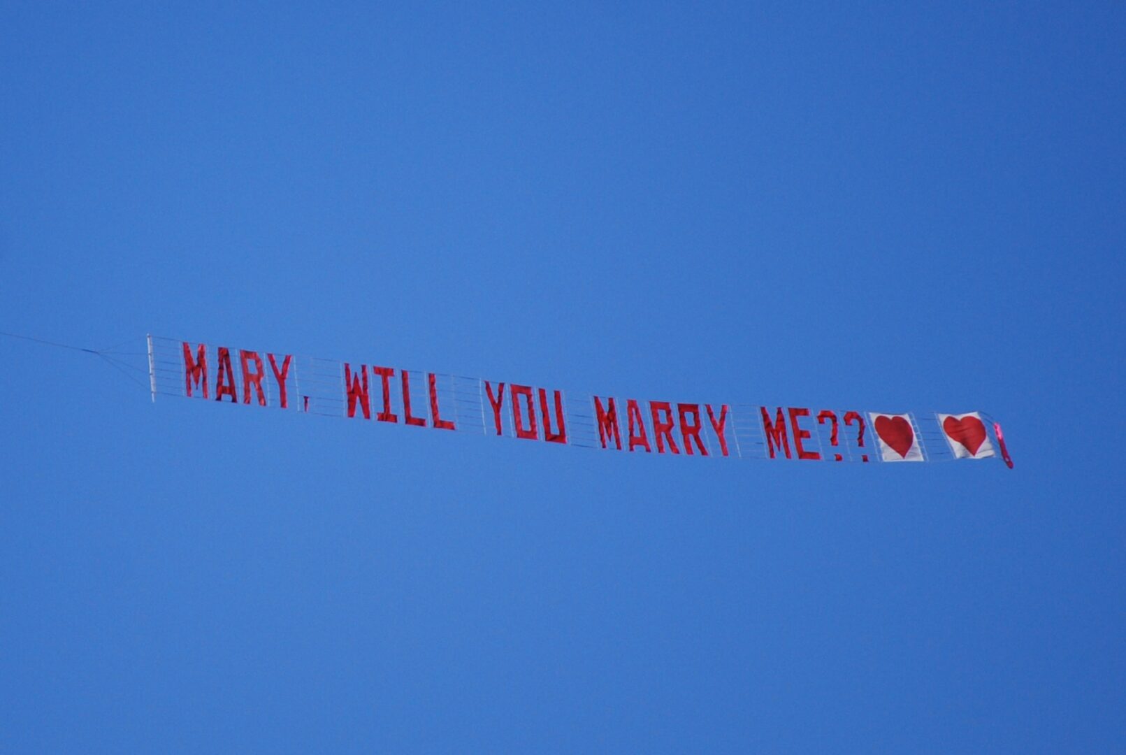 A banner that says marry, will you marry me ?