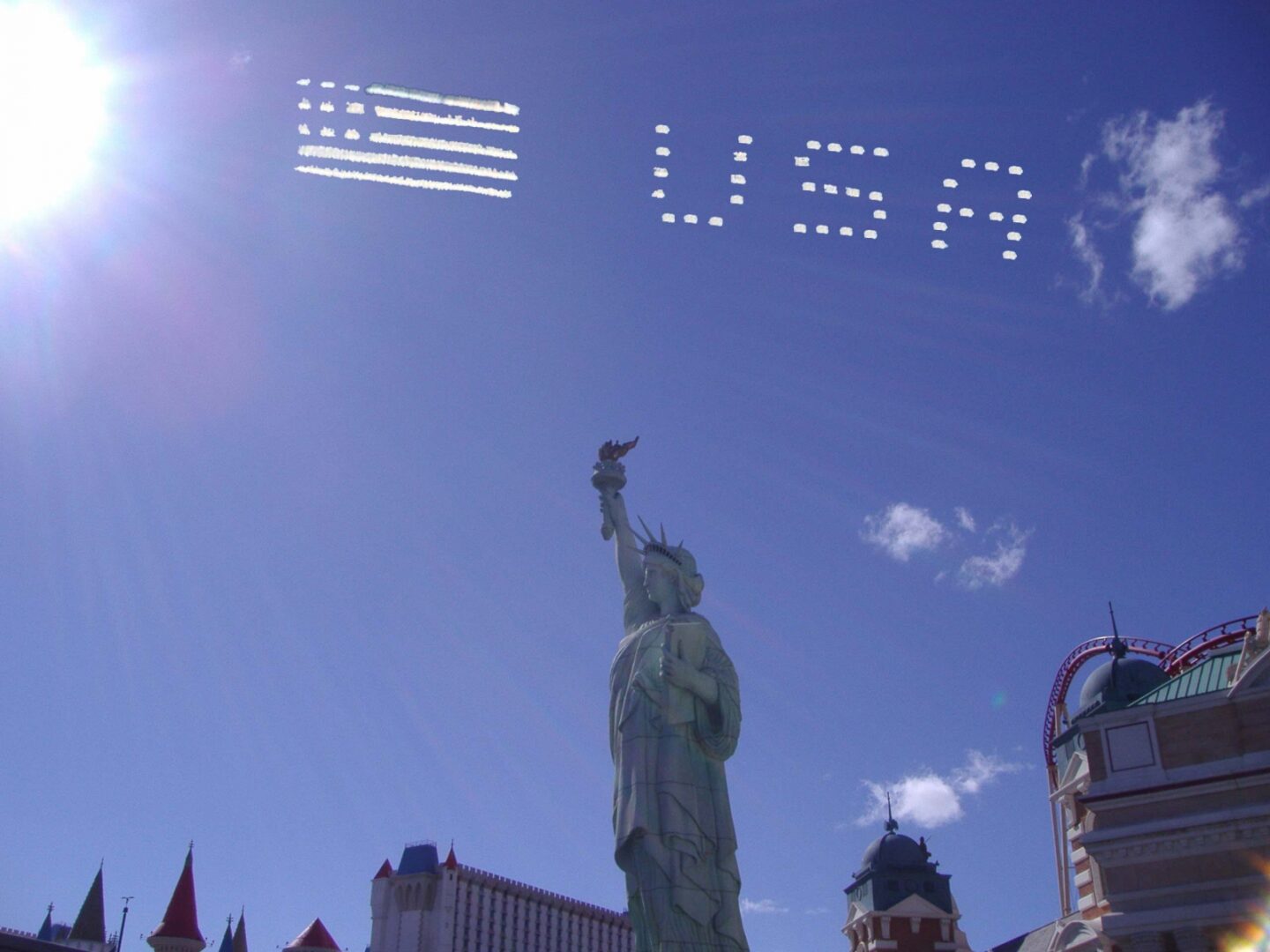 A group of planes flying in the sky with usa written on them.